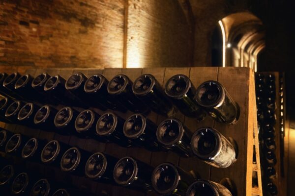 Pupitre And Bottles Inside An Underground Cellar For The — Langhe and Sardinia tour by Italy Travel Specialist