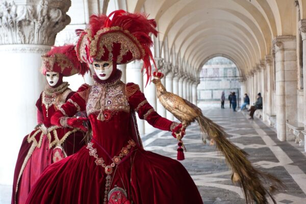A Pair Of Masks Perform For The Venice Carnival In Piazza — Northern Italy luxury tour by Italy Travel Specialist